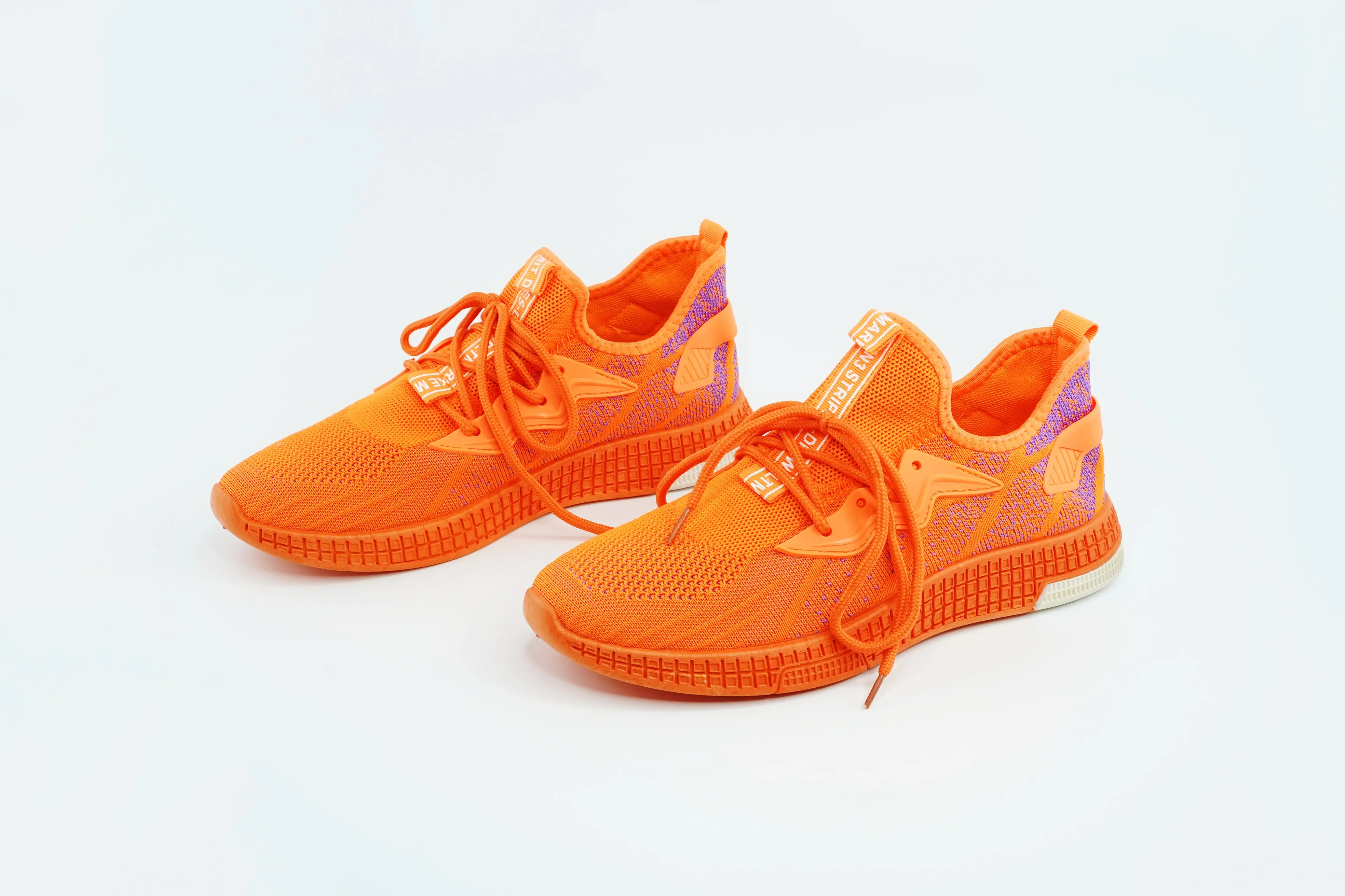 Mesh canvas running shoes in orange color